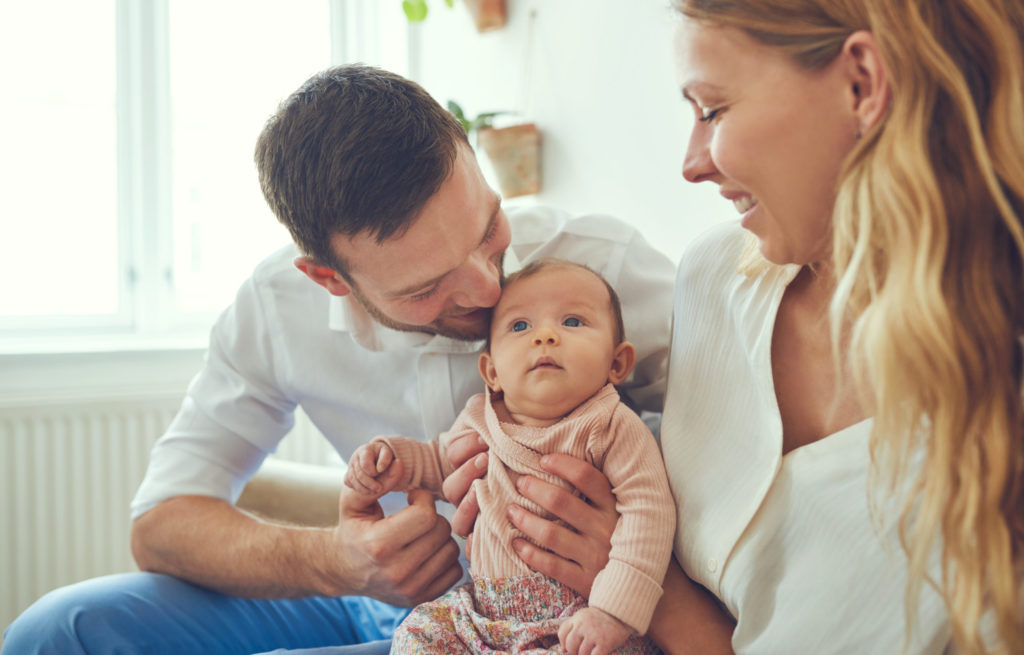 Proud new parents of an adorable baby girl